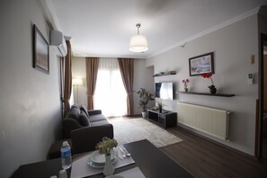 Familien-Suite, 1 Queen-Bett und Schlafsofa | Wohnbereich