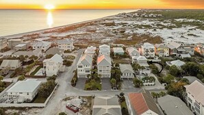 An aerial view of a coastal residential area with houses, roads, and a beach. - Steps away from Grayton Beach, Large Private Saltwater Pool, 4 Bedrooms, 4 Baths (Santa Rosa Beach)