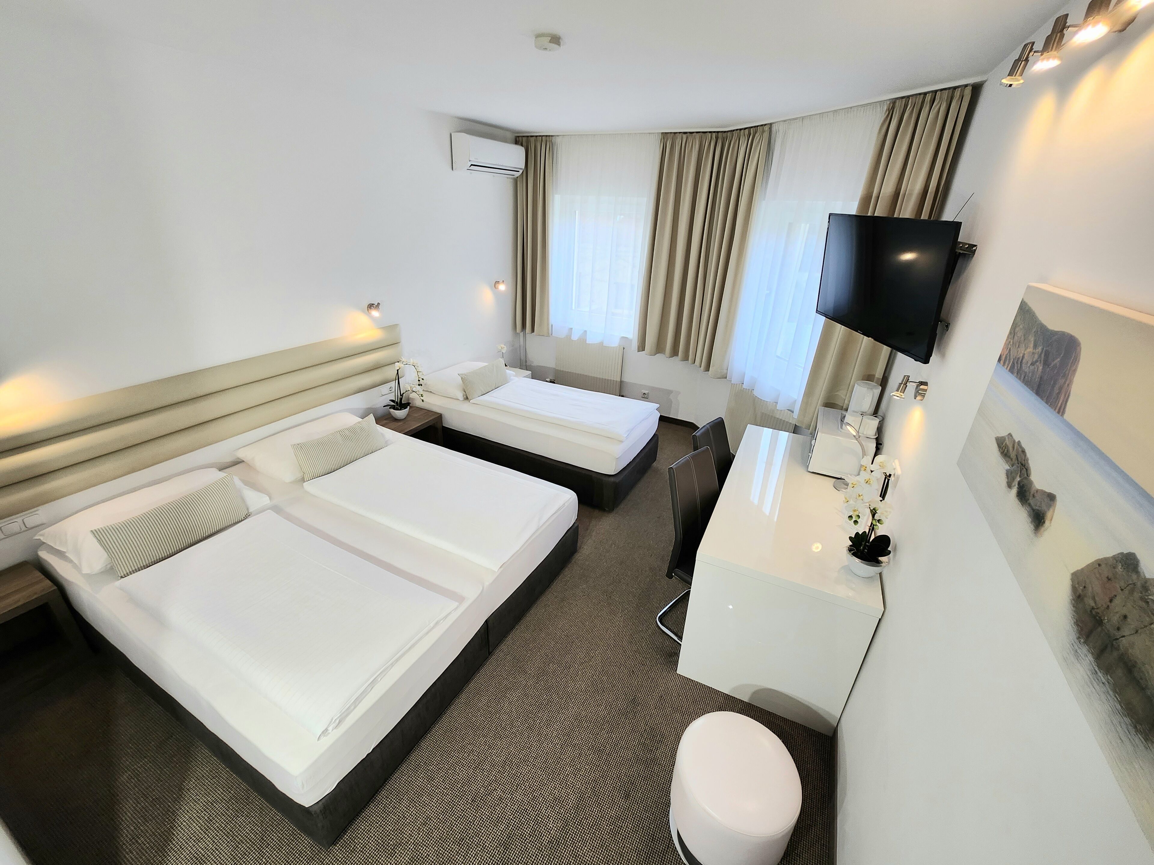 triple room | in-room safe, desk, blackout curtains, iron/ironing board