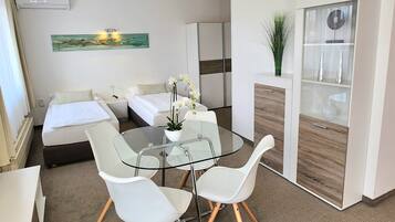 Quadruple Room | In-room safe, desk, blackout drapes, iron/ironing board