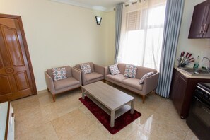 42-inch flat-screen TV with cable channels, TV - PCG Gishushu Apartment (Kigali)