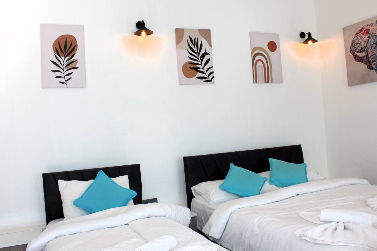 Economy Room, Multiple Beds, Patio, Garden View | Desk, laptop workspace, blackout drapes, soundproofing