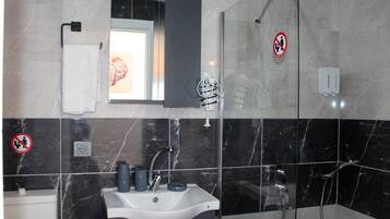 Economy Room, Patio, Garden View | Bathroom | Shower, designer toiletries, hair dryer, slippers