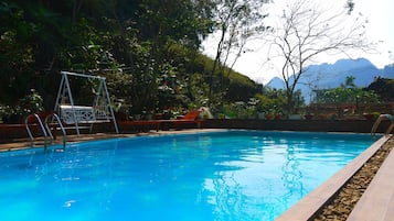 Outdoor pool, pool umbrellas, sun loungers