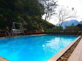 Outdoor pool, pool umbrellas, sun loungers