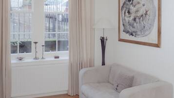 Studio, 1 King Bed | Living area | Plasma TV, DVD player