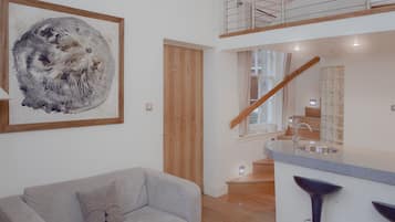 Studio, 1 King Bed | Living area | Plasma TV, DVD player