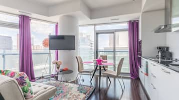 Signature Apartment, 1 Bedroom, Kitchen, City View | Living room | 43-inch TV with satellite channels, Netflix