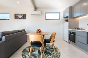 House, 1 Bedroom | Private kitchen | Full-size fridge, microwave, oven, stovetop - Guest House on Queens (Waiheke Island)