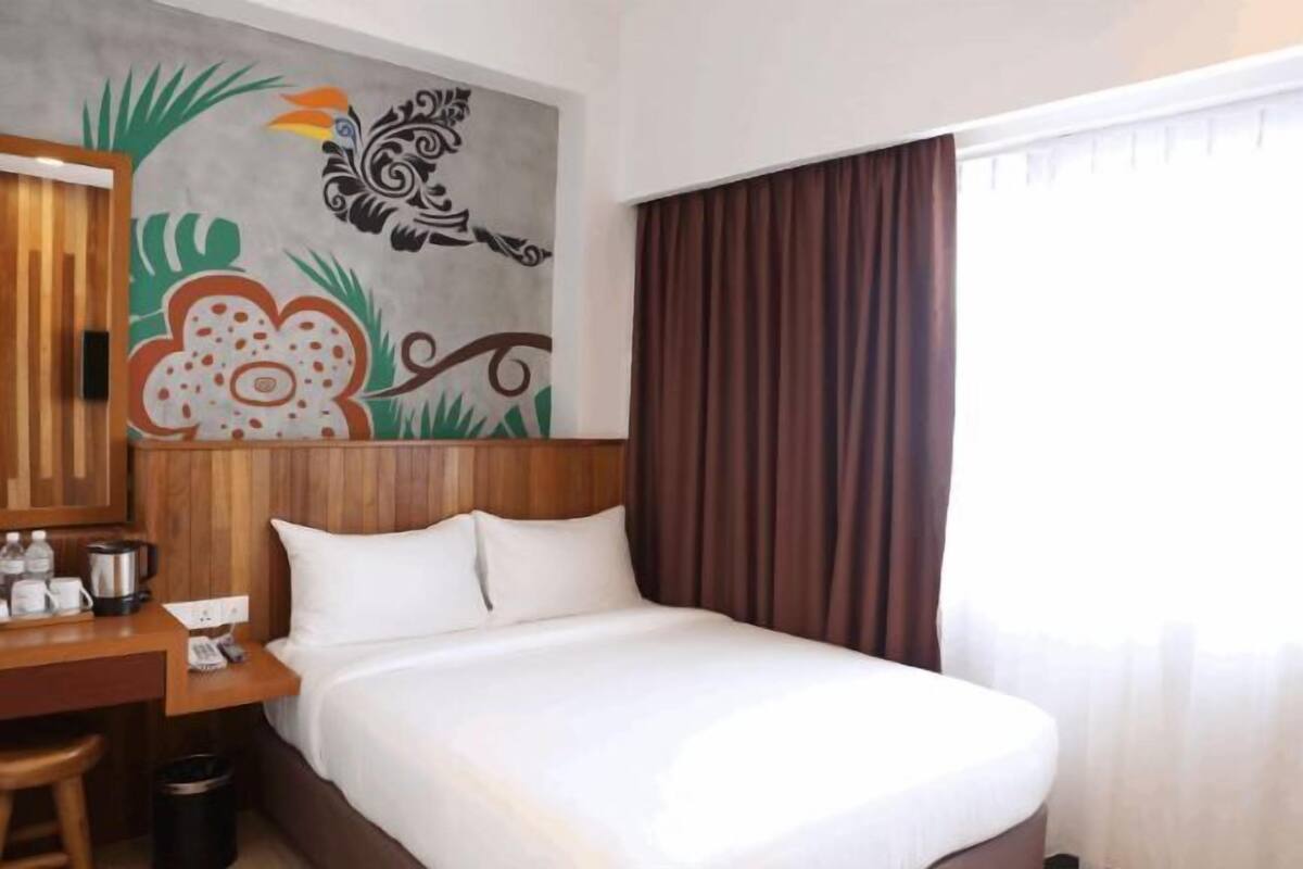 Luxe beddengoed, een minibar, een kluis op de kamer