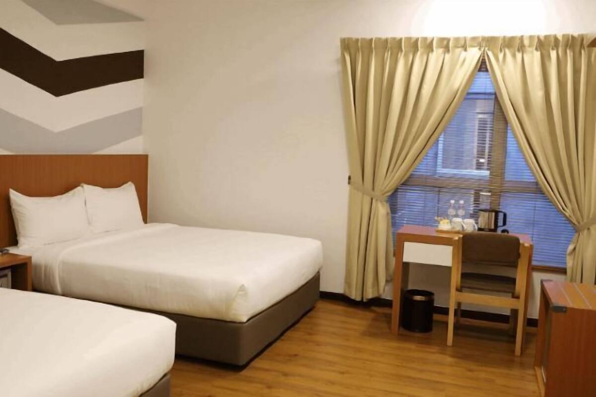 Luxe beddengoed, een minibar, een kluis op de kamer