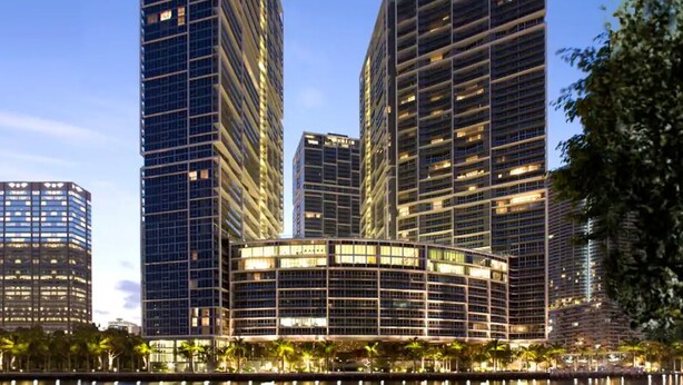 A modern high-rise building complex with multiple skyscrapers, featuring a mix of glass and steel facades, and a waterfront setting. - Amazing apartment Miami Brickell with spectacular views  (Miami)