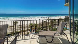 A balcony with a view of a beach and ocean. - Phoenix West 3 BR ~ LOW FLOOR!!! (Orange Beach)