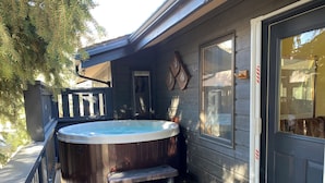 A hot tub with steps, a wooden deck, and a door with a glass panel. - 260+ 10★ Reviews!  Between Vail & Beaver Creek Hot Tub/Fire Table/Ski/Hike/ Golf (Vail)