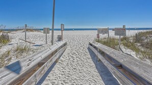 A wooden boardwalk leading to a sandy beach with clear blue skies. - Gorgeous Gulf Views From This Orange Beach Condo on the 11th Floor! (Orange Beach)