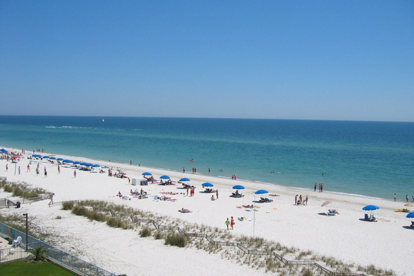 Grab a lounger and an umbrella from the beach boy and chill