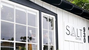 A building with a sign reading "SALT CULTURE" and a window display with plants. - Gorgeous Ocean View Twinhome w/AC! (Encinitas)