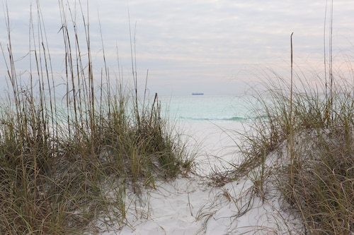 This adorable cottage is DIRECTLY ON THE BEACH-RARE FIND!