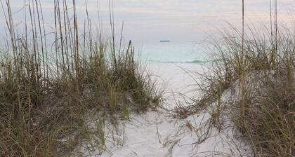 This adorable cottage is DIRECTLY ON THE BEACH-RARE FIND!