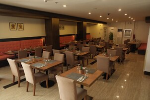 Breakfast, lunch, dinner served; local cuisine 