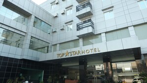A modern hotel with a prominent sign reading "TOP STAR HOTEL". - Top Star Hotel (Cabanatuan)