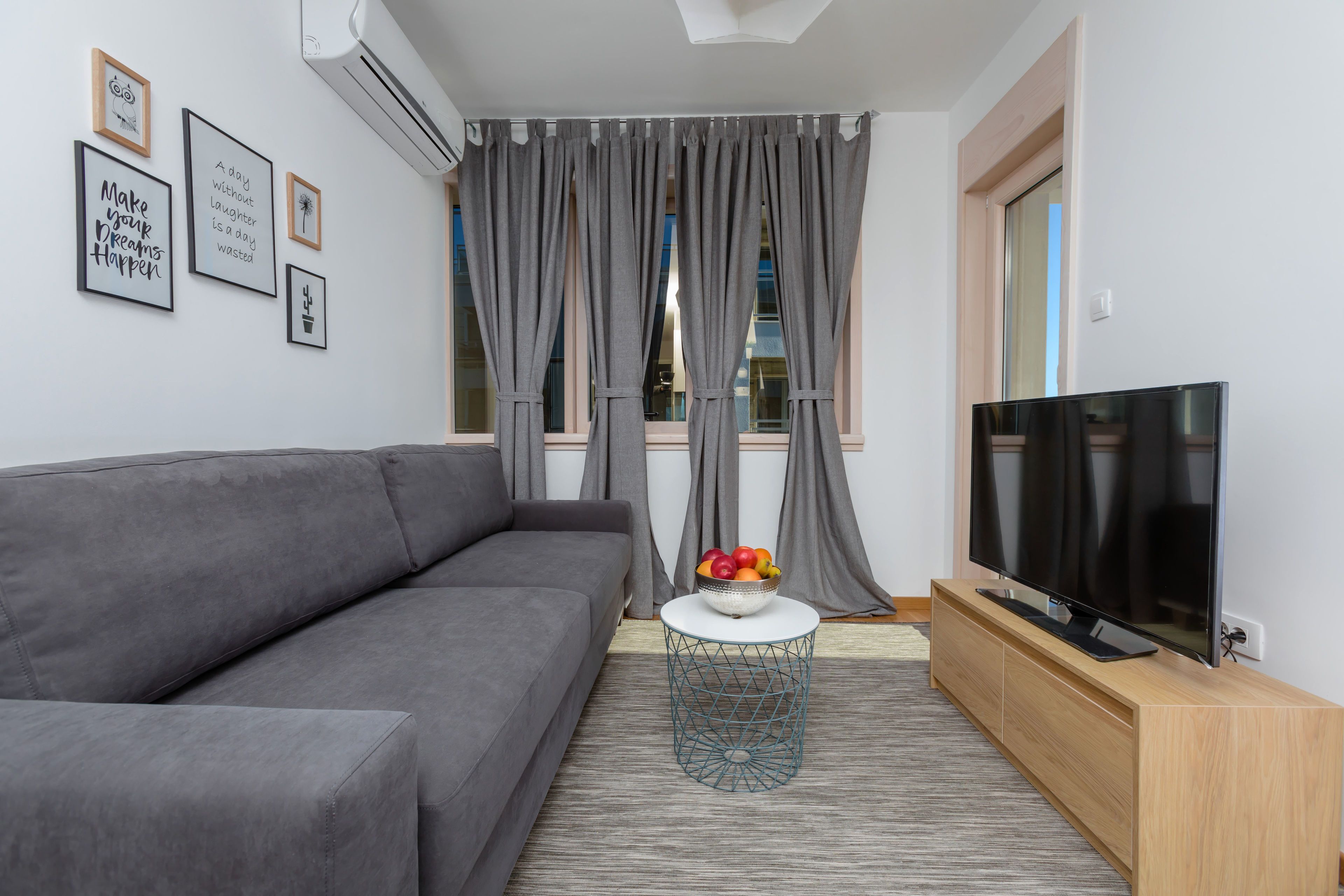 apartment, 1 bedroom, balcony, sea view | living area | flat-screen tv