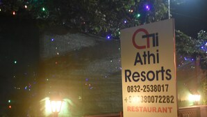 A sign for Athi Resorts with contact numbers and a restaurant label. - Athi Resorts (Marmagao)