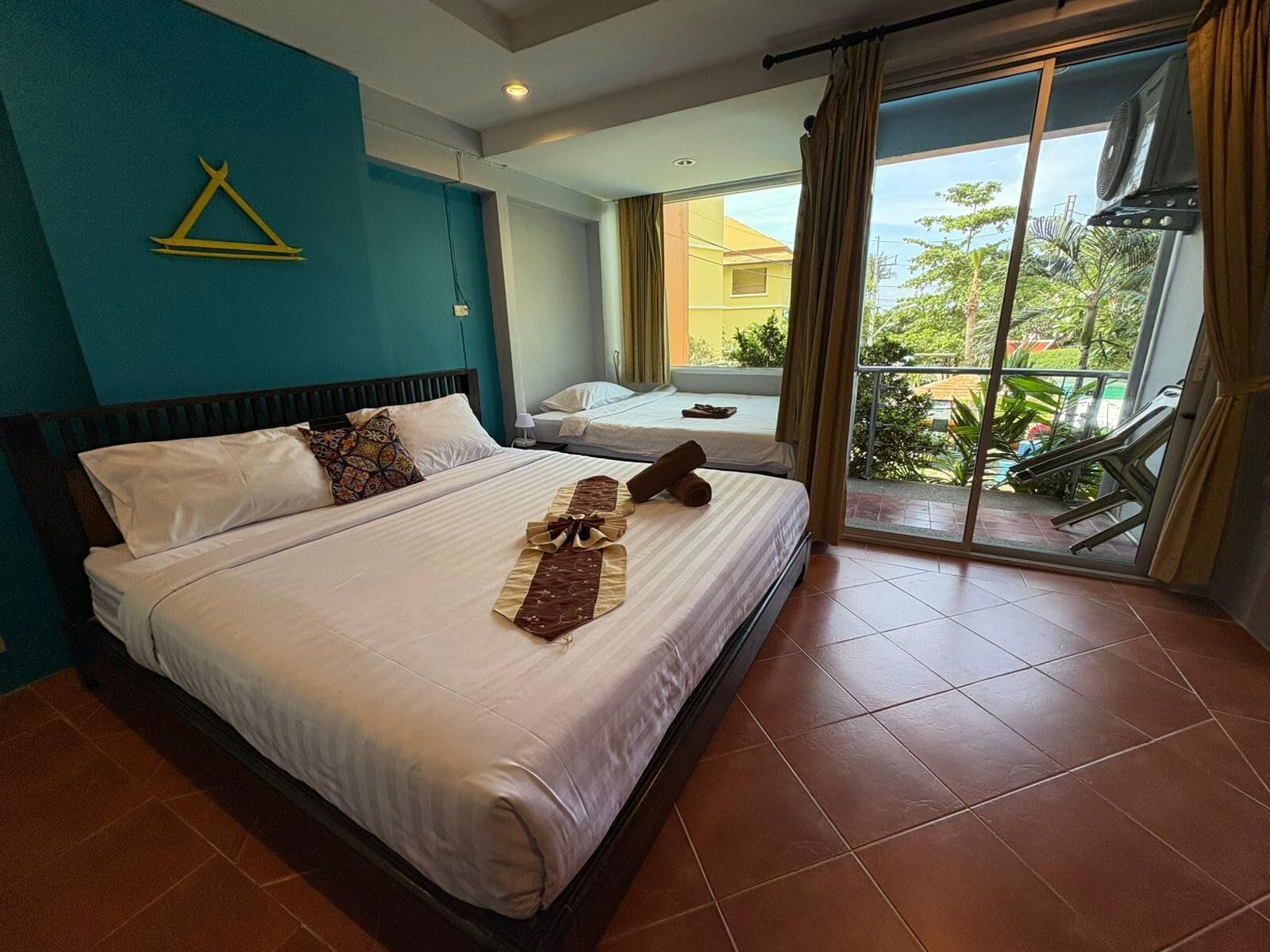 deluxe triple room, resort view | down duvets, tempur-pedic beds, minibar, in-room safe