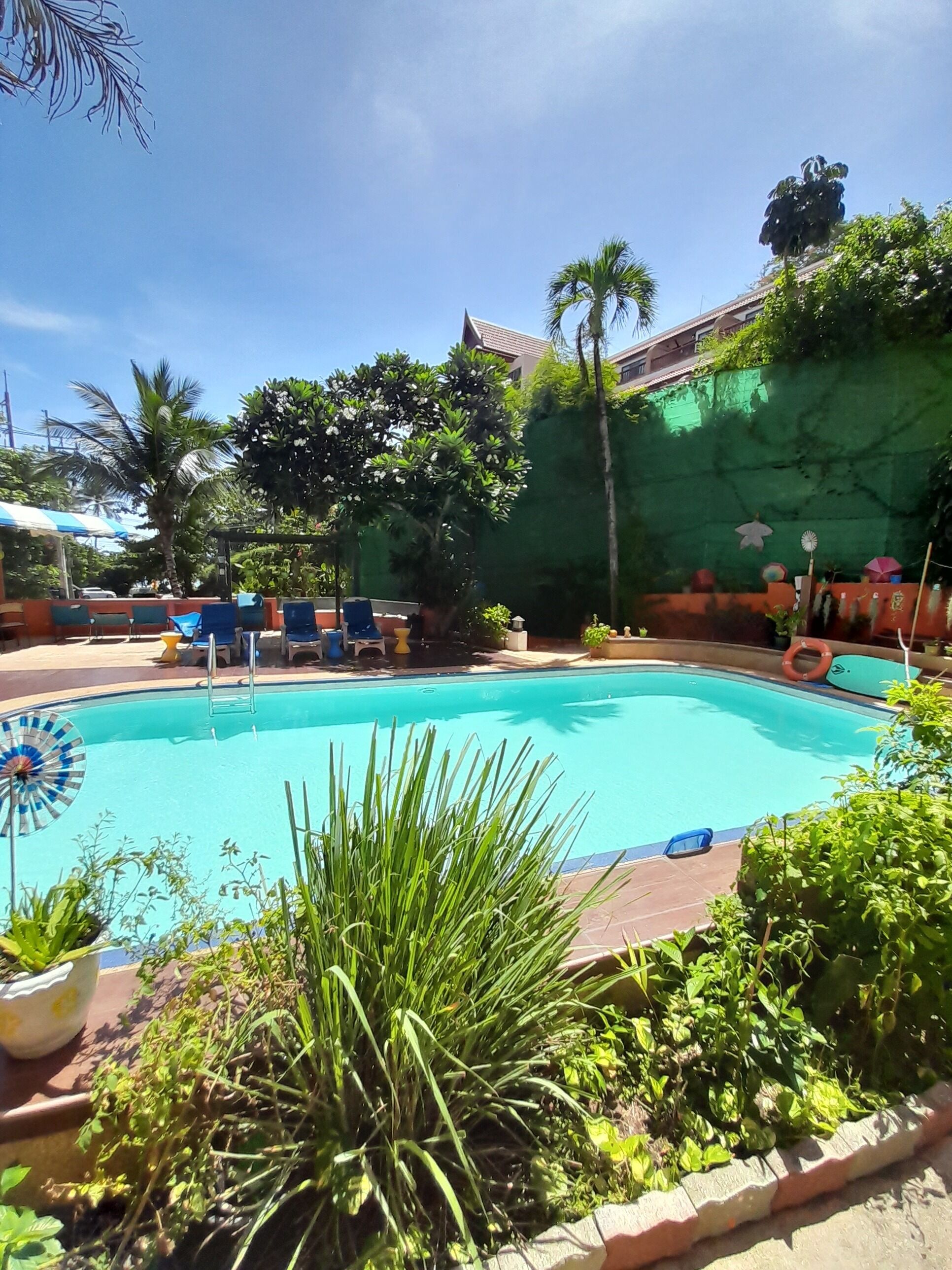 outdoor pool, open 7:00 am to 10:00 pm, pool umbrellas, pool loungers