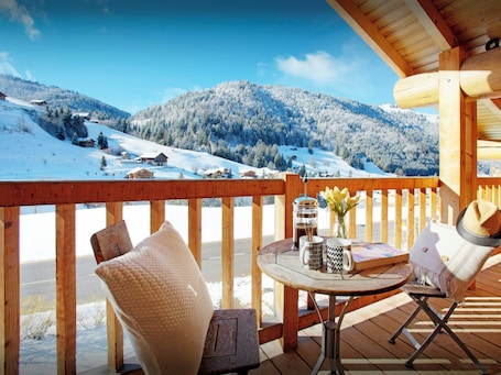 Outdoor dining. Chalet Le Mousqueton - ski base for 14 spa & mountain views - OVO Network