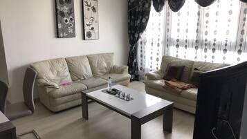 Appartement, 1 slaapkamer | Woonkamer | Flatscreentelevisie