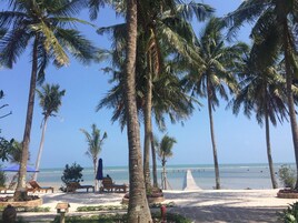Private beach, white sand, sun loungers, beach umbrellas