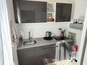 Fridge, microwave, stovetop, coffee/tea maker