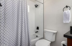 Combined shower/bathtub, hair dryer, towels, soap