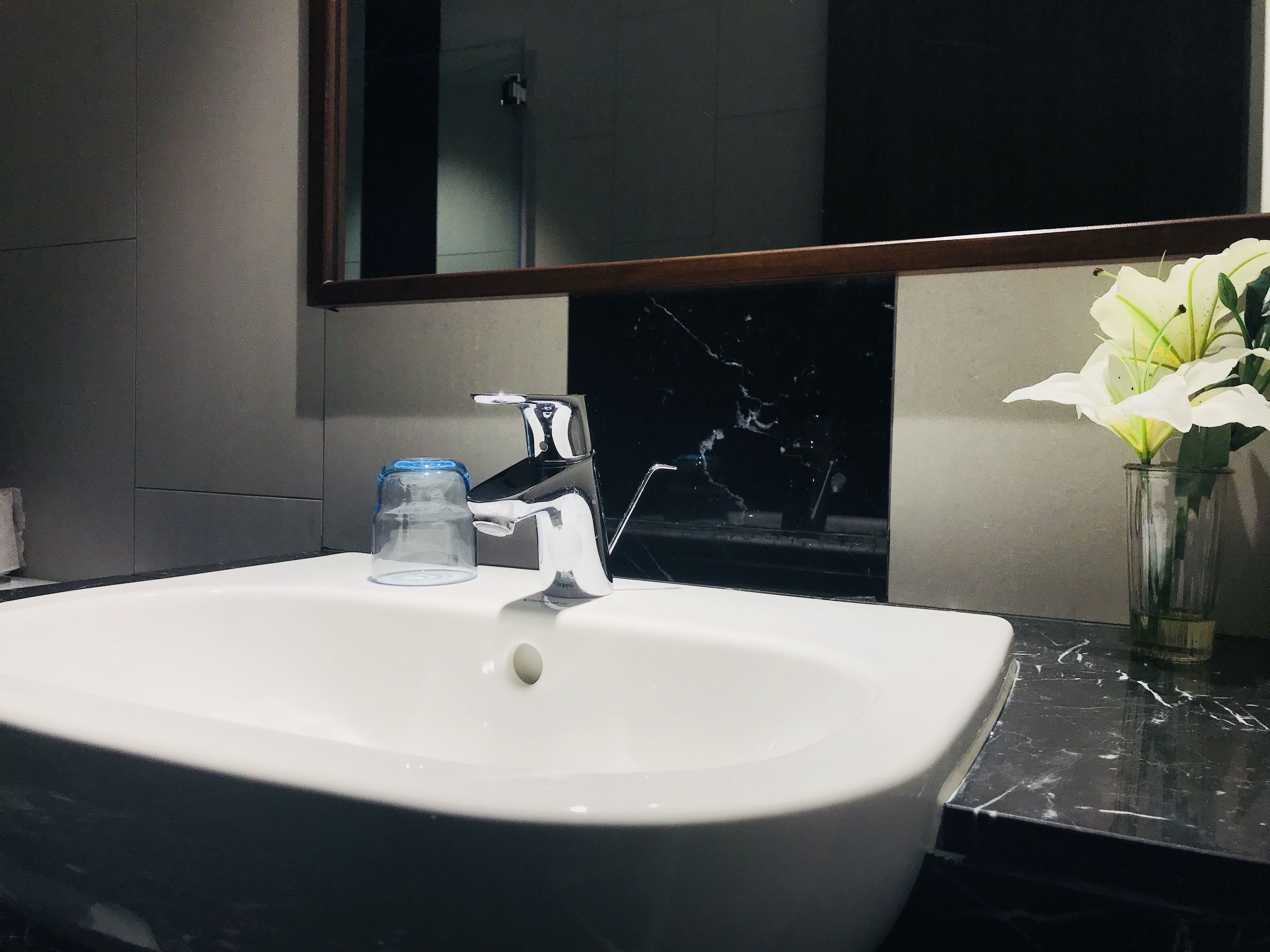 A bathroom sink with a mirror above it.