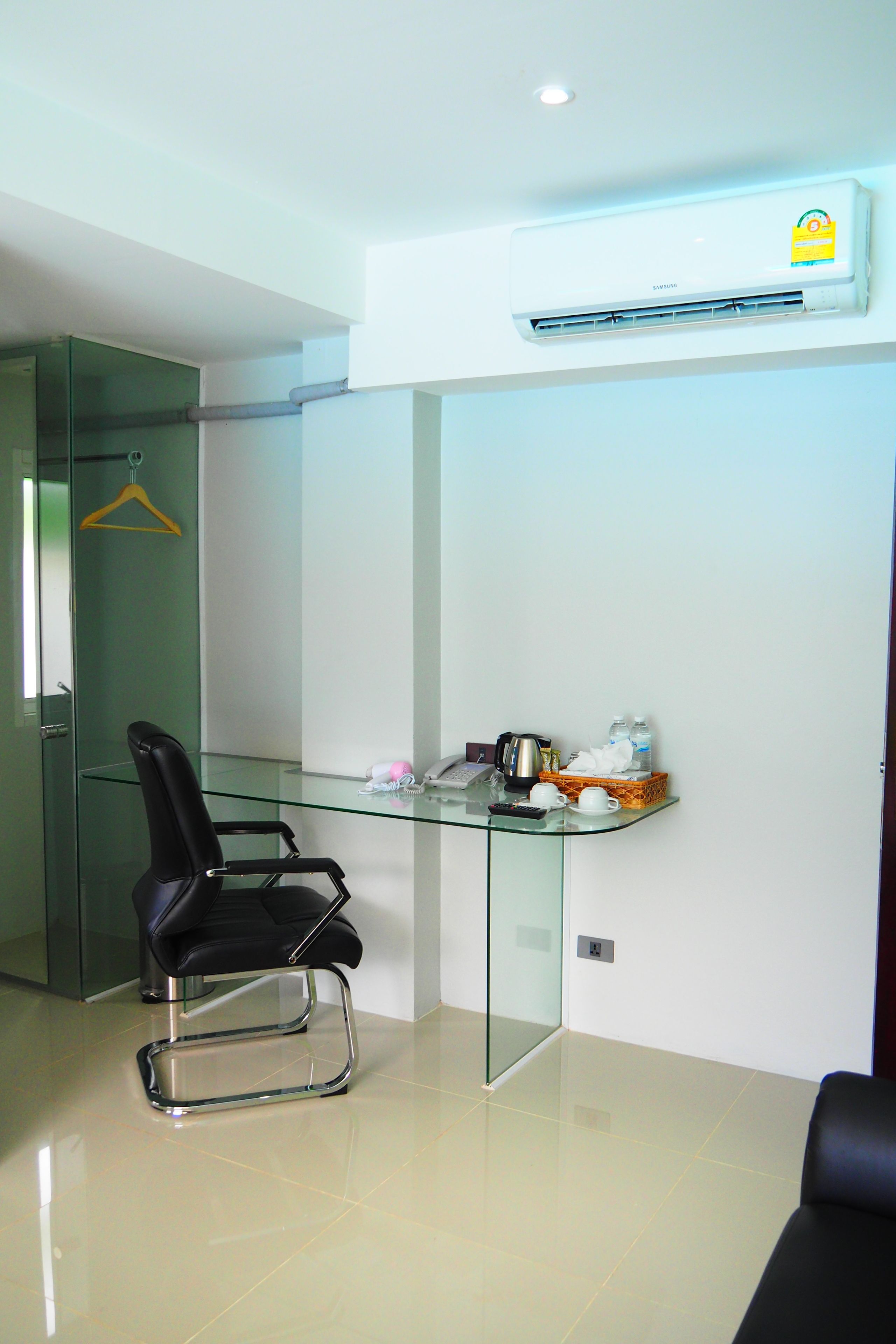 junior room, pool view | desk, laptop workspace, blackout curtains, soundproofing