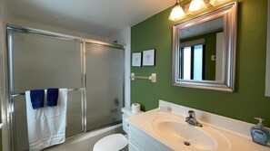 Combined shower/tub, hair dryer, towels, soap