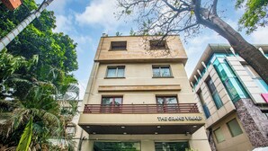 A multi-story building with a sign reading "The Grand Vikalp." -  The Grand Vikalp by Saga Hotels (New Delhi)