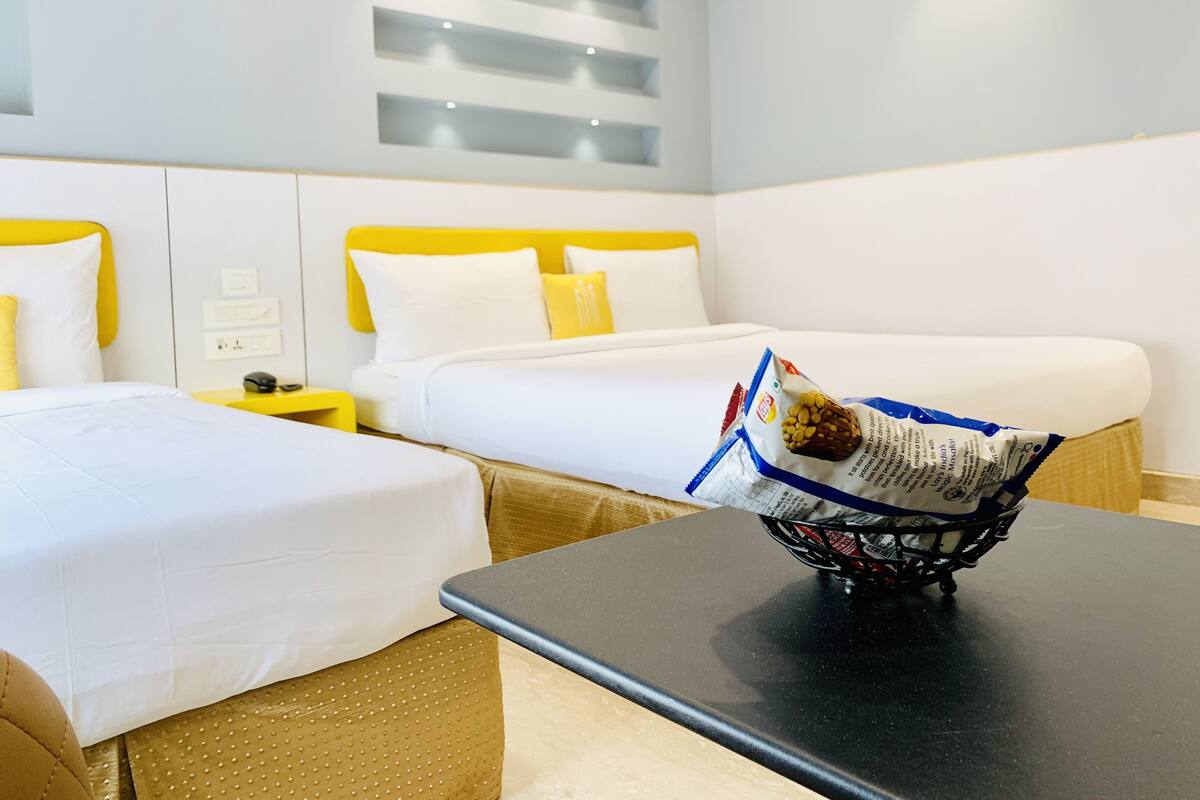 Deluxe-Dreibettzimmer | Hochwertige Bettwaren, Betten mit Memory-Foam-Matratzen, Zimmersafe