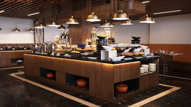 Una moderna disposición tipo buffet con múltiples estaciones de servicio, iluminación colgante y un piso de mármol pulido.