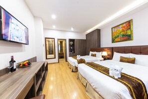 Deluxe Family Room | Minibar, in-room safe, desk, blackout drapes - Mai Thang Hotel (Da Lat)
