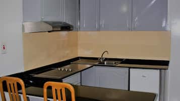 Apartment, 1 Bedroom (Twin Beds) | Private kitchen | Fridge, stovetop