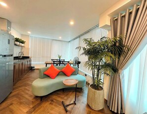 Signature Suite, 1 King Bed, Patio, City View | Minibar, in-room safe, desk, soundproofing - Dinh Ami Hanoi Hotel (Hanoi)