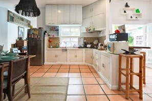 Enjoy cooking in this well-equipped kitchen with ample counter space and modern appliances.