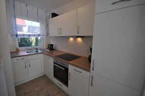 Fridge, oven, dishwasher, high chair