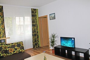 Appartement Confort, 1 chambre, cuisine | Coin séjour