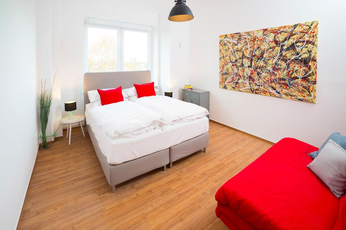 Apartment, 3 Bedrooms, Balcony | Laptop workspace, blackout drapes, soundproofing, iron/ironing board