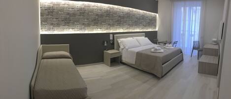 Comfort Quadruple Room | Premium bedding, in-room safe, desk, soundproofing