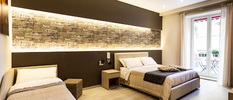Comfort Quadruple Room | Premium bedding, in-room safe, desk, soundproofing
