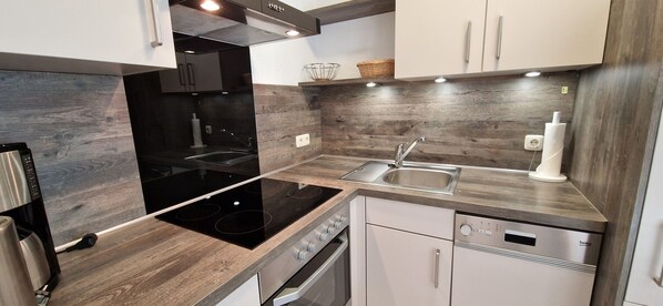 Fridge, oven, dishwasher, high chair